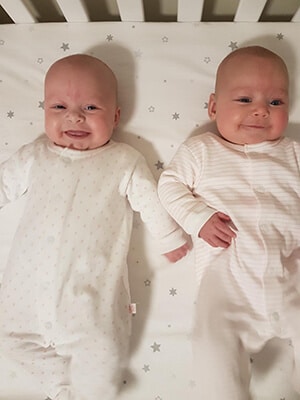 baby-twins-smiling-in-crib